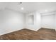 Finished basement with modern flooring and a convenient built-in mirror at 3560 Cardinal Way, Carmel, IN 46074