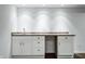 Finished basement wet bar features stone countertops and plenty of cabinet storage at 3560 Cardinal Way, Carmel, IN 46074