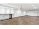 Spacious finished basement featuring a bar area, hardwood floors, and built-in shelving at 3560 Cardinal Way, Carmel, IN 46074