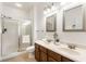Bright bathroom featuring a glass-enclosed shower, double sink vanity, and modern fixtures at 3560 Cardinal Way, Carmel, IN 46074