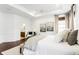 Spacious main bedroom featuring hardwood floors, neutral paint, natural light, and en suite bathroom at 3560 Cardinal Way, Carmel, IN 46074