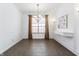 Open dining room with natural light, modern chandelier, and contemporary wall decor at 3560 Cardinal Way, Carmel, IN 46074