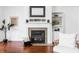 Close up of the living room fireplace with decorative shelving and built-in cabinets at 3560 Cardinal Way, Carmel, IN 46074