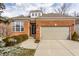 Charming brick home with a well-maintained lawn and attached two car garage, promising curb appeal at 3560 Cardinal Way, Carmel, IN 46074