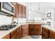 Well-appointed kitchen featuring a gas cooktop, ample counter space, and a modern backsplash at 3560 Cardinal Way, Carmel, IN 46074