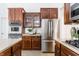 Modern kitchen featuring stainless steel appliances, ample cabinetry, and sleek countertops at 3560 Cardinal Way, Carmel, IN 46074