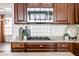 Close up on a modern kitchen featuring custom cabinetry and stainless steel appliances at 3560 Cardinal Way, Carmel, IN 46074