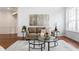 Comfortable living room showcases stylish decor, hardwood floors and large windows for natural light at 3560 Cardinal Way, Carmel, IN 46074