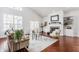 Open living room with large windows, vaulted ceilings and fireplace creates an airy atmosphere at 3560 Cardinal Way, Carmel, IN 46074