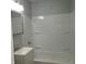 Clean bathroom featuring a shower over the tub and white vanity and a medicine cabinet at 3841 Monica Ct, Indianapolis, IN 46226