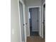 Neutral hallway features tiled floors, fresh paint, and access to multiple rooms at 3841 Monica Ct, Indianapolis, IN 46226