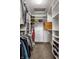 Walk-in closet with custom shelving, drawers, and ample hanging space for organized storage at 3905 Pelham Rd, Carmel, IN 46074