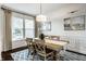 Charming dining area with hardwood floors, decorative rug, and bright natural light at 3905 Pelham Rd, Carmel, IN 46074