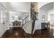 Spacious foyer with hardwood floors, staircase, and open view to dining room at 3905 Pelham Rd, Carmel, IN 46074