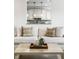 Close up of kitchenette with white cabinets and decorative backsplash and countertops at 3905 Pelham Rd, Carmel, IN 46074
