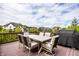 Outdoor dining area on a wooden deck with views of the neighborhood at 3905 Pelham Rd, Carmel, IN 46074