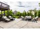 Spacious outdoor patio with comfortable seating, an area rug, and a backyard view at 3905 Pelham Rd, Carmel, IN 46074