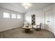 Upstairs sitting room provides a cozy nook featuring natural light and neutral decor at 3905 Pelham Rd, Carmel, IN 46074