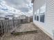 Backyard featuring a stone patio adjacent to a fence-lined property at 3941 Planewood Dr, Indianapolis, IN 46235