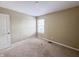 Bedroom with a neutral color palette and standard window, ready for personalization at 3941 Planewood Dr, Indianapolis, IN 46235