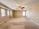 A spacious bedroom with natural light, featuring a ceiling fan and neutral-toned walls at 3941 Planewood Dr, Indianapolis, IN 46235