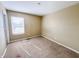 A standard bedroom featuring neutral walls and a window to allow natural light at 3941 Planewood Dr, Indianapolis, IN 46235