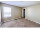 A standard bedroom offering natural light through a window and neutral walls at 3941 Planewood Dr, Indianapolis, IN 46235