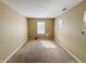 A standard bedroom offering natural light through a window and neutral walls at 3941 Planewood Dr, Indianapolis, IN 46235