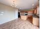 Bright kitchen featuring wood-look flooring, ample cabinet space, and a functional kitchen island at 3941 Planewood Dr, Indianapolis, IN 46235