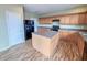 Well-designed kitchen with a functional island, ample storage, and modern black appliances at 3941 Planewood Dr, Indianapolis, IN 46235