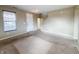 Inviting living room with a front door, interior door, neutral walls, carpet and staircase at 3941 Planewood Dr, Indianapolis, IN 46235