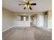 Bright open-concept living room with an opening through to another room, view of kitchen at 3941 Planewood Dr, Indianapolis, IN 46235