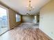 Expansive open-concept space blending indoor and outdoor living with access to the backyard at 3941 Planewood Dr, Indianapolis, IN 46235