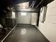 Clean basement with painted walls and floor, exposed ceiling, and a window for natural light at 4224 Cornelius Ave, Indianapolis, IN 46208