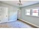Bedroom features neutral carpet, two windows and white doors at 4224 Cornelius Ave, Indianapolis, IN 46208