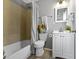 A pristine bathroom with a tub/shower, sleek vanity, and neutral finishes, designed for relaxation at 4457 N Kenmore Rd, Indianapolis, IN 46226