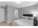 This beautifully furnished bedroom offers a serene retreat with modern decor and hard wood flooring at 4457 N Kenmore Rd, Indianapolis, IN 46226