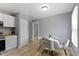 Cozy dining area adjacent to the kitchen with stylish table and chairs at 4457 N Kenmore Rd, Indianapolis, IN 46226