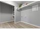 Functional laundry room with shelving and ample space for storage at 4457 N Kenmore Rd, Indianapolis, IN 46226