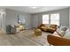Airy living room with large windows, offering ample natural light and comfortable seating at 4457 N Kenmore Rd, Indianapolis, IN 46226