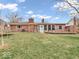 Spacious backyard with mature trees and a small deck perfect for outdoor entertaining at 504 Pelenor Dr, Franklin, IN 46131