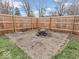 Fenced backyard with fire pit area perfect for gatherings, relaxation, and enjoying time outdoors at 504 Pelenor Dr, Franklin, IN 46131