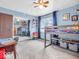 Bright bedroom with a bunk bed, mirrored closet doors reflecting the room, and a ceiling fan for added comfort at 504 Pelenor Dr, Franklin, IN 46131