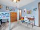 Cozy blue bedroom featuring a bunk bed, desk and natural wood dresser for ample storage and a fun space at 504 Pelenor Dr, Franklin, IN 46131