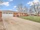 Charming brick ranch home features a two car garage, mature trees, and well maintained lawn at 504 Pelenor Dr, Franklin, IN 46131