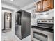 Modern kitchen boasting stainless steel appliances, marble flooring, and functional storage space at 504 Pelenor Dr, Franklin, IN 46131