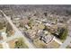 An aerial view of a quiet neighborhood with well-maintained homes and tree-lined streets, showcasing community charm at 5055 Willow Rd, Zionsville, IN 46077