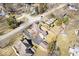 A scenic aerial view of homes nestled among mature trees, with well-kept yards and convenient access to roadways at 5055 Willow Rd, Zionsville, IN 46077