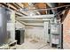 Basement with exposed brick, water heater, and HVAC system at 5055 Willow Rd, Zionsville, IN 46077