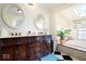Bathroom with a dual vanity, a soaking tub, and checkered floors at 5055 Willow Rd, Zionsville, IN 46077